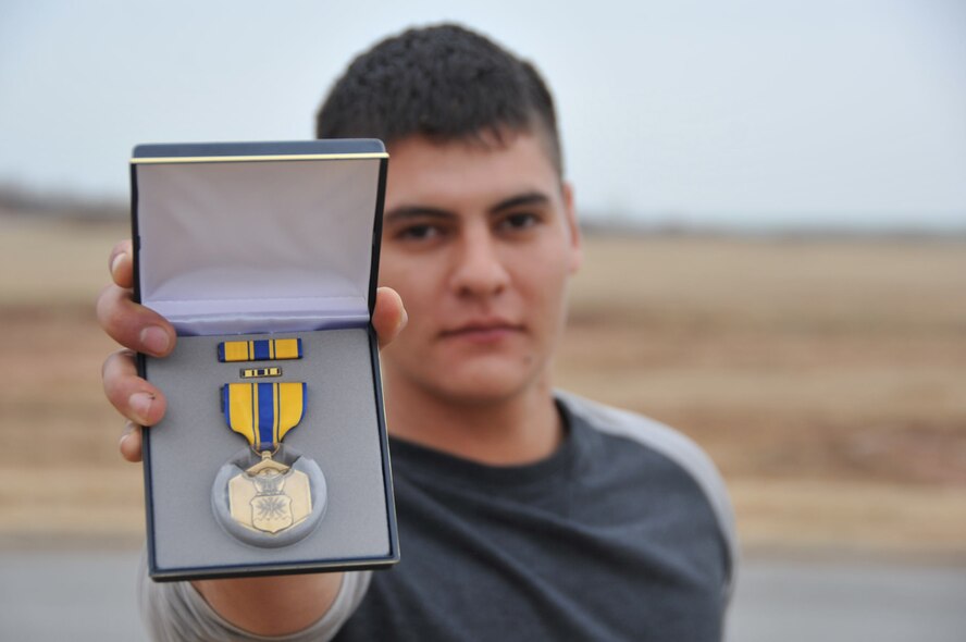 Airman 1st Class Joe Serna, 82nd Security Forces Squadron entry controller, was presented as Air Force Commendation Medal Nov. 20, 2014, on Sheppard Air Force Base, Texas, for an act of courage. Serna and a fellow wingman disarmed a highly intoxicated Airman at a party who was threatening the lives of those around him. 
