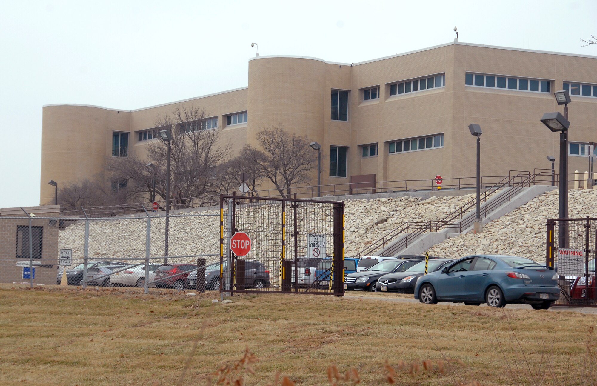 A vehicle enters the Ehrling Bergquist Clinic at Offutt Air Force Base Neb. from the 25th Street south entrance located at the lower parking area. This entrance will be the single point of access to the clinic with the scheduled closing of two other entrances Jan 5. Vehicles will still be able to exit the clinic from this exit along with the Capehart Road exit. (U.S. Air Force photo by Delanie Stafford/Released)
