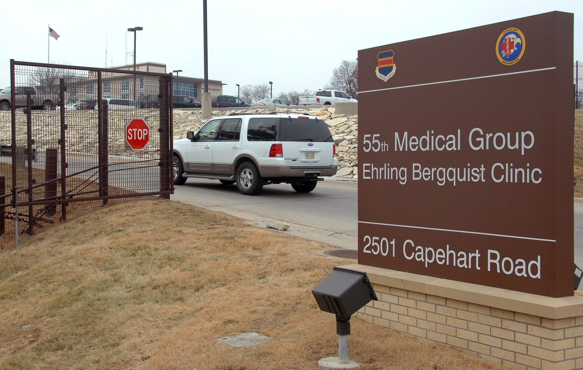 A vehicle enters the Ehrling Bergquist Clinic at Offutt Air Force Base, Neb. from one of two entrances located on 25th Street. This entrance along with the Capehart Road entrance will be closed Jan. 5 and all vehicles will be required to enter the clinic from a single entrance on 25th Street located at the lower parking area. (U.S. Air Force photo by Delanie Stafford/Released)