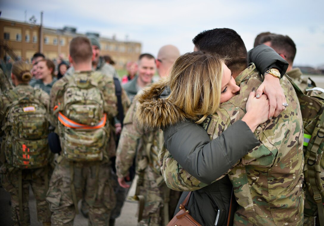 Members of the 30th Aerial Port Squadron return home Dec. 6, 2014 at Niagara Falls Air Reserve Station, N.Y. 35 personnel from the base were sent to a deployment in Afghanistan. (U.S. Air Force Photo by Staff Sgt. Stephanie Sawyer) 