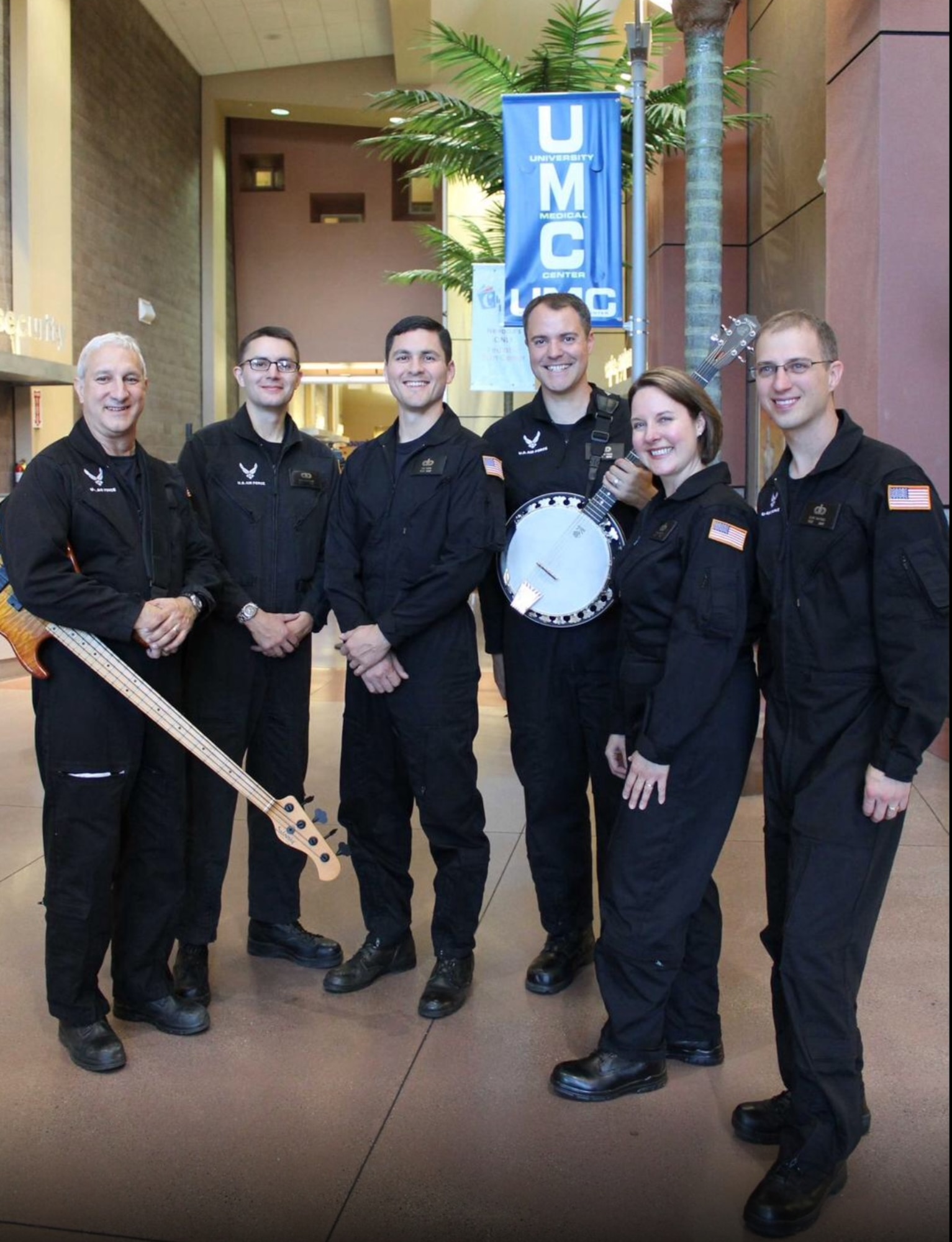Members of the United States Air Force Band of the Golden West rock band, Mobility, pose for a recent group photo. (Courtesy photo)