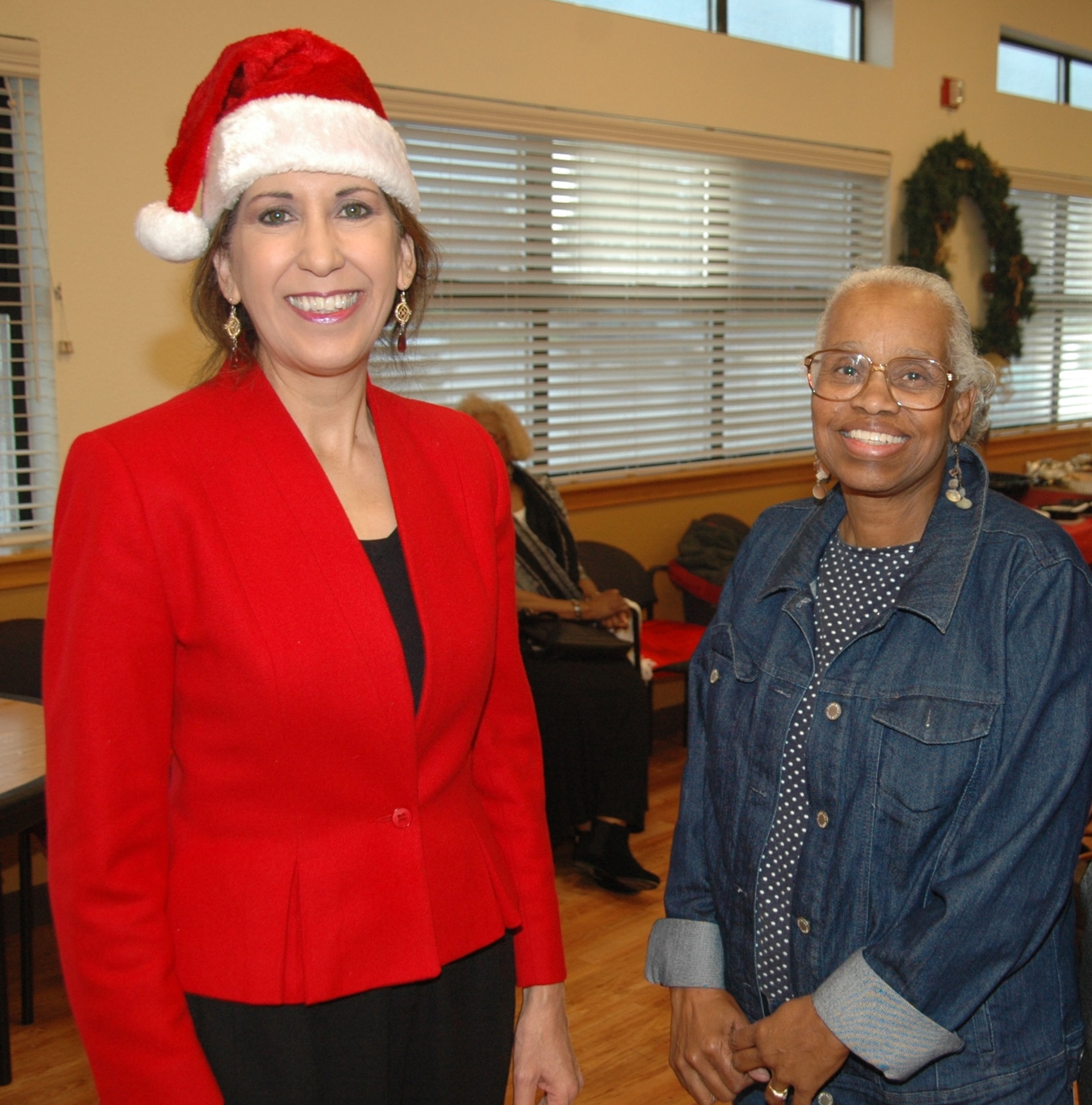 Incoming American Red Cross station manager Lisa Ann Rohr stands with Joan Kelley-Williams, former ARC station manager at David Grant USAF Medical Center, who retired Dec. 5 after 30 years of service to the Red Cross. (U.S. Air Force photo/Jim Spellman)