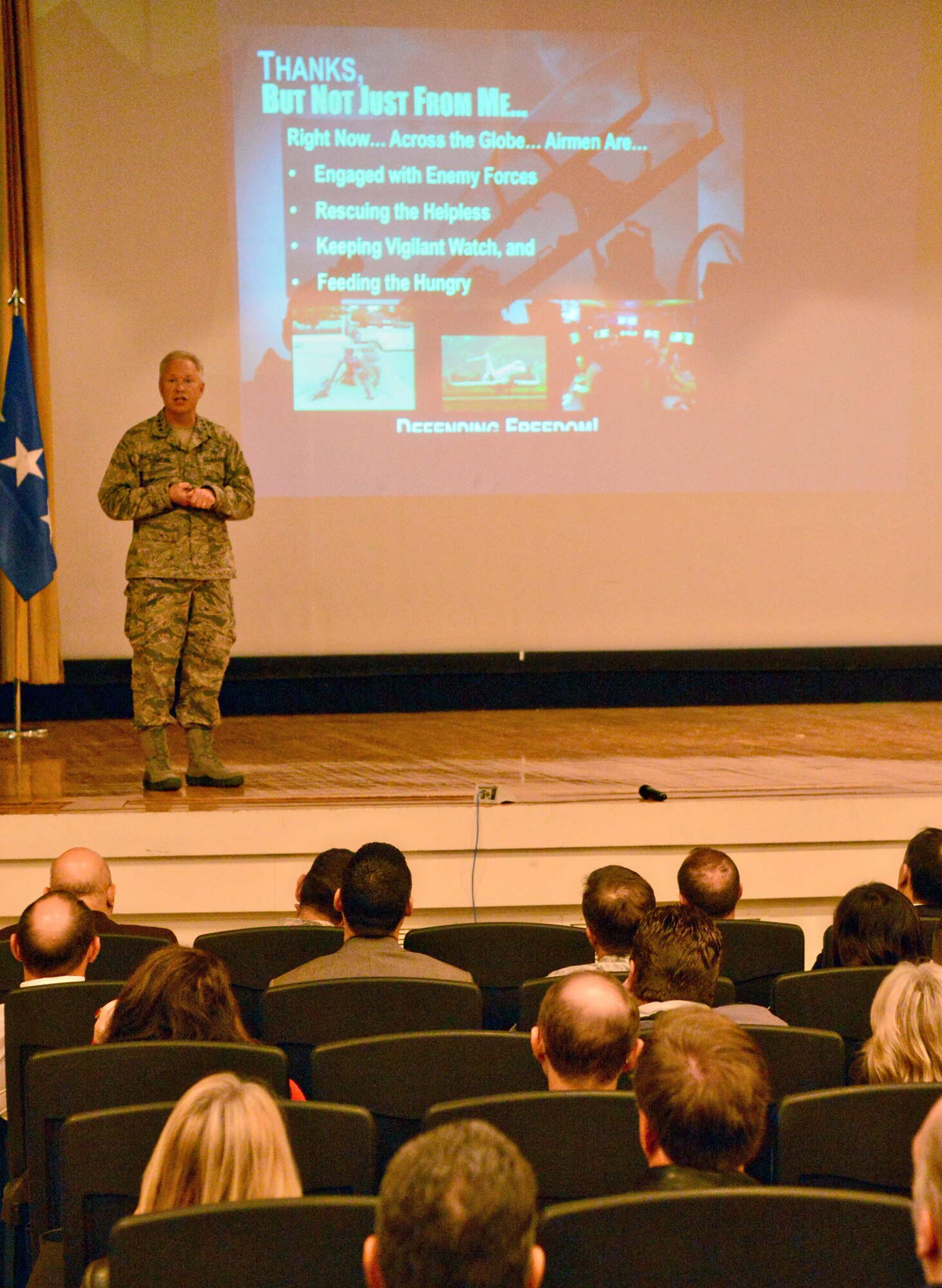 Lt. Gen. John Thompson, commander of the Air Force Life Cycle Management Center, briefs members of his organization during a Dec. 3 all-call at the Tinker Auditorium. (Air Force photo by Kelly White)