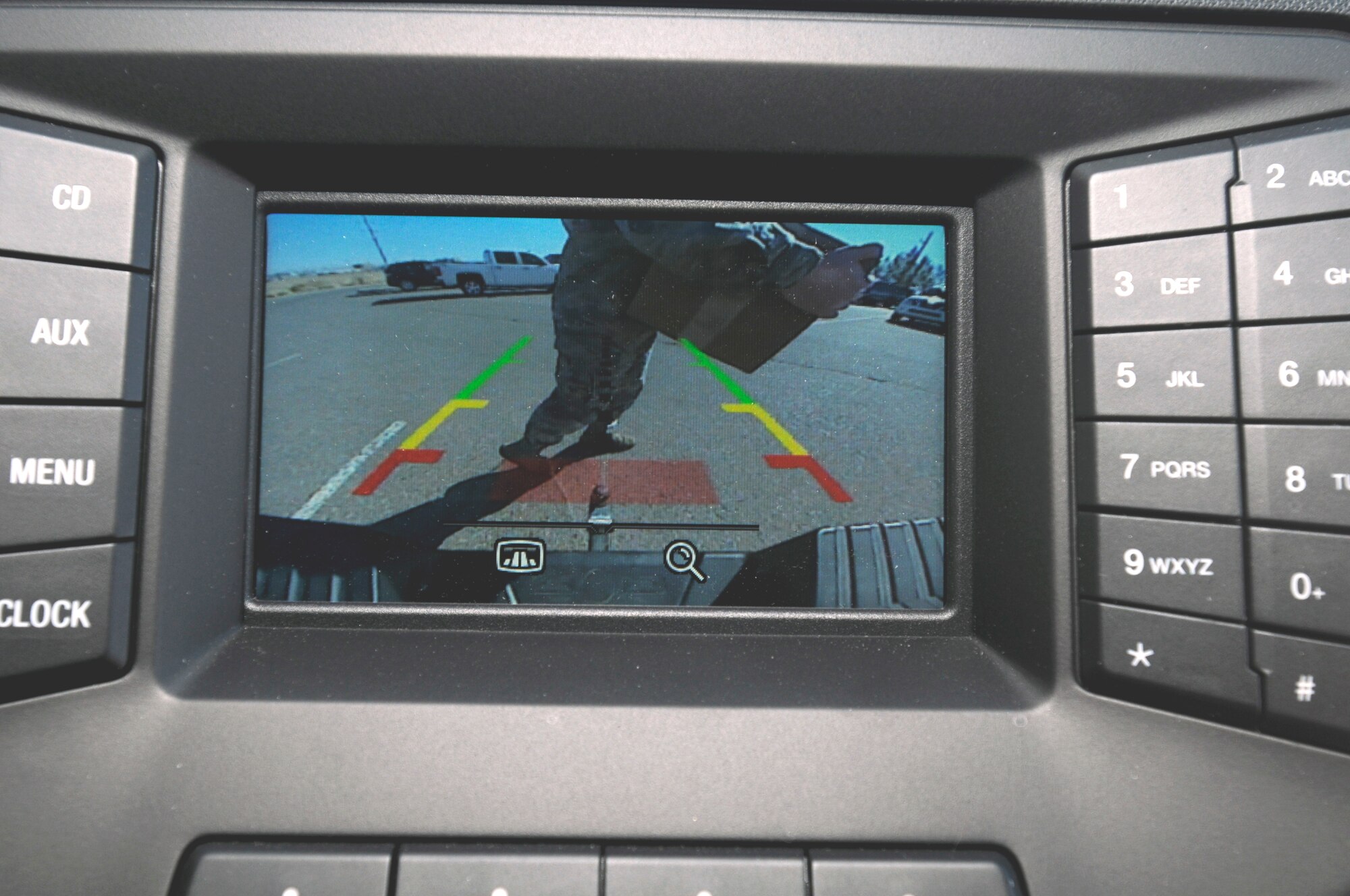 The driver's view of the image from a backup camera when there's an object or person behind the vehicle. (U.S. Air Force photo by Keith Wright)
