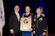 Lt. Col. Brian Beckno, an Army instructor at Air University’s Air Command and Staff College, Maxwell Air Force Base, Alabama, accepts the 2014 Secretary of Defense Award for Excellence in Maintenance Training, Advice and Assistance of Foreign Security Forces (Ministerial Category) on behalf of the men and women he led as commander of 2nd Battalion, 87th Infantry Regiment, or Task Force Catamount.  Task Force Catamount earned the award for their work with the Afghan National Army’s 4th Brigade, 203rd Corps last year.  (Air Force Photo by Master Sgt. David Maxwell, 117th Air Refueling Wing/Cleared)