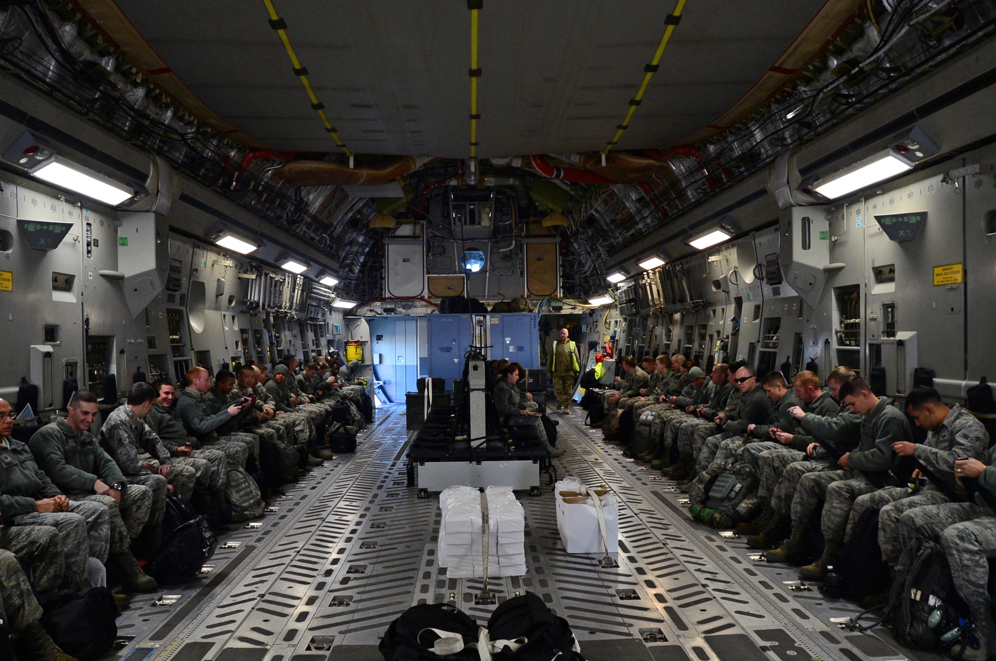 48th Fighter Wing Airmen prepare to deploy to Aviano, Air Base, Italy, Dec. 3, 2014 at Royal Air Force Lakenheath, England. The Movement Coordination Centre Europe program gives the U.S. the opportunity to work with our allied nations and strengthen those bond. (U.S. Air Force photo by Senior Airman Erin O’Shea/Released)