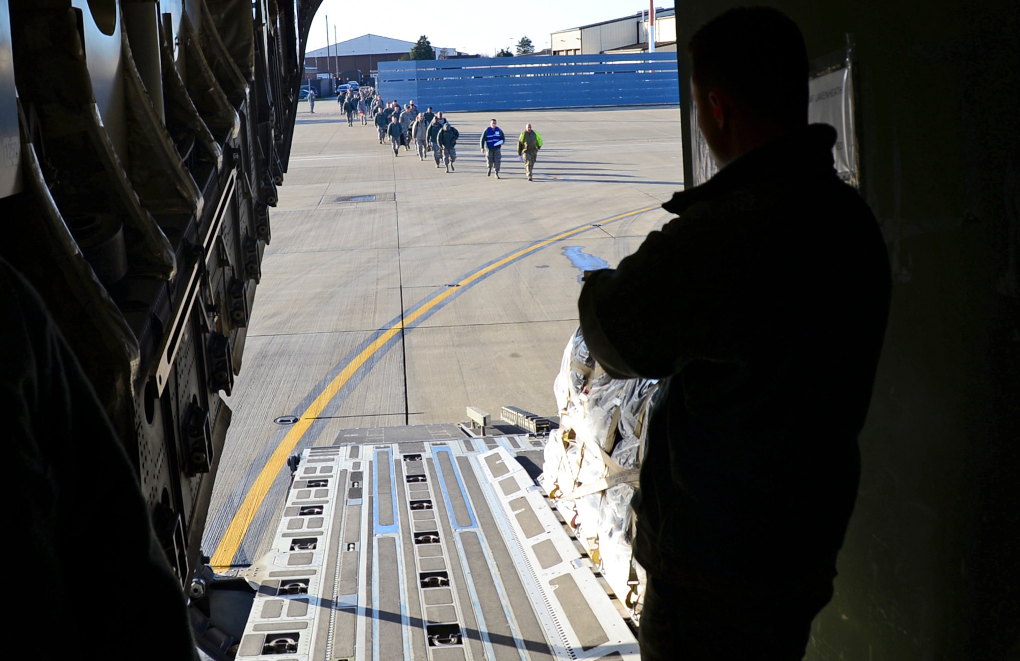 48th Fighter Wing Airmen board a Royal Air Force C-17A Globemaster III before deploying to Aviano Air Base, Italy, Dec. 3, 2014 at Royal Air Force Lakenheath, England. The Movement Coordination Centre Europe program gives the U.S. the opportunity to work with our allied nations and strengthen those bond. (U.S. Air Force by Senior Airman Erin O’Shea/Released)