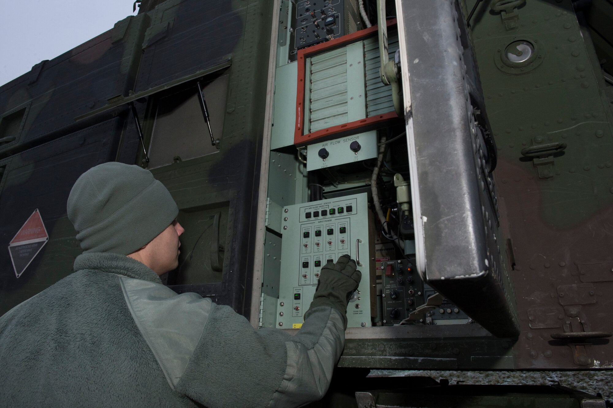 U.S. Army Pfc. Jeremy Messer, Delta 57th Air Defense Artillery patriot switch operator, maintains the AN/MPQ-65 multifunctional phased array radar system during training with the 480th Fighter Squadron at Spangdahlem Air Base, Germany, Dec. 9, 2014. The training tested the capabilities of the radar and the F-16 Fighting Falcon fighter aircraft’s ability to discover the radar’s limitations for real-world sorties. 
(U.S. Air Force photo by Staff Sgt. Christopher Ruano/Released)

