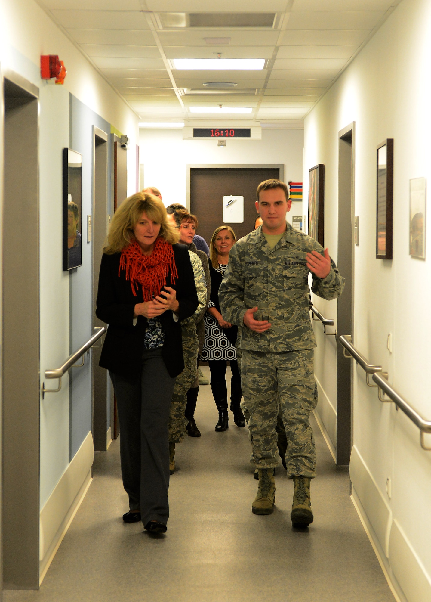 Cheryl Roberson, wife of U.S. Air Force Lt. Gen. Darryl Roberson, 3rd Air Force and 17th Expeditionary Air Force commander, and U.S. Air Force Airman 1st Class James Roberts, 52nd Medical Operations Squadron aerospace medical technician, tour the base clinic at Spangdahlem Air Base, Germany, Dec. 9, 2014. Roberts and other 52nd MDOS Airmen updated Roberson on the new technologies and resources the facility provides to Spangdahlem. (U.S. Air Force photo by Airman 1st Class Luke Kitterman/Released)  