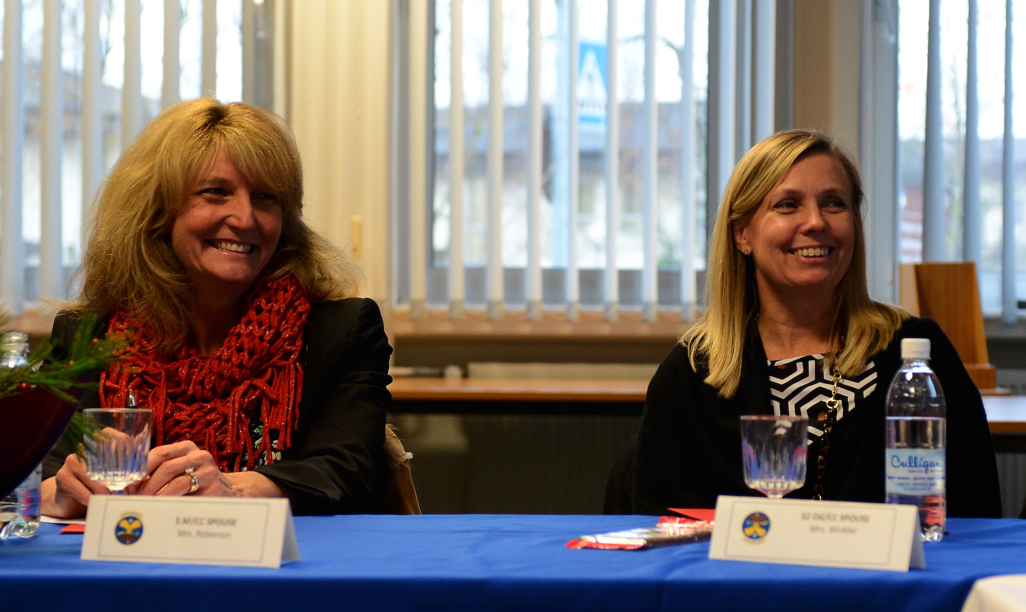 Cheryl Roberson, left, wife of U.S. Air Force Lt. Gen. Darryl Roberson, 3rd Air Force and 17th Expeditionary Air Force commander, and Kristen Winkler visit the 52nd Force Support Squadron Airmen and Family Readiness Center at Spangdahlem Air Base, Germany, Dec. 9, 2014. Roberson made stops at multiple locations during her visit to include the Airman’s Attic, 52nd Medical Group clinic and Eifel Powerhaus. (U.S. Air Force photo by Airman 1st Class Luke Kitterman/Released) 