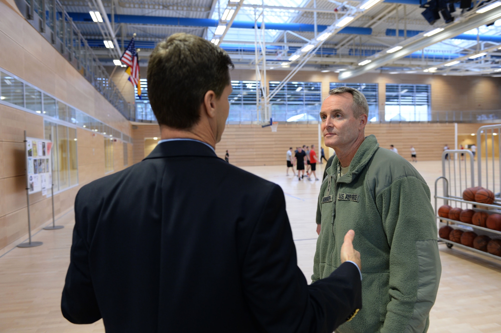 Jude Sorg, 52nd Force Support Squadron deputy commander, briefs U.S. Air Force Lt. Gen. Darryl Roberson, 3rd Air Force and 17th Expeditionary Air Force commander, during a facility tour Dec. 9, 2014, at the Eifel Powerhaus at Spangdahlem Air Base, Germany.  Roberson toured the new facility that replaced the old fitness center in 2013. (U.S. Air Force photo by Airman 1st Class Dylan Nuckolls/Released)