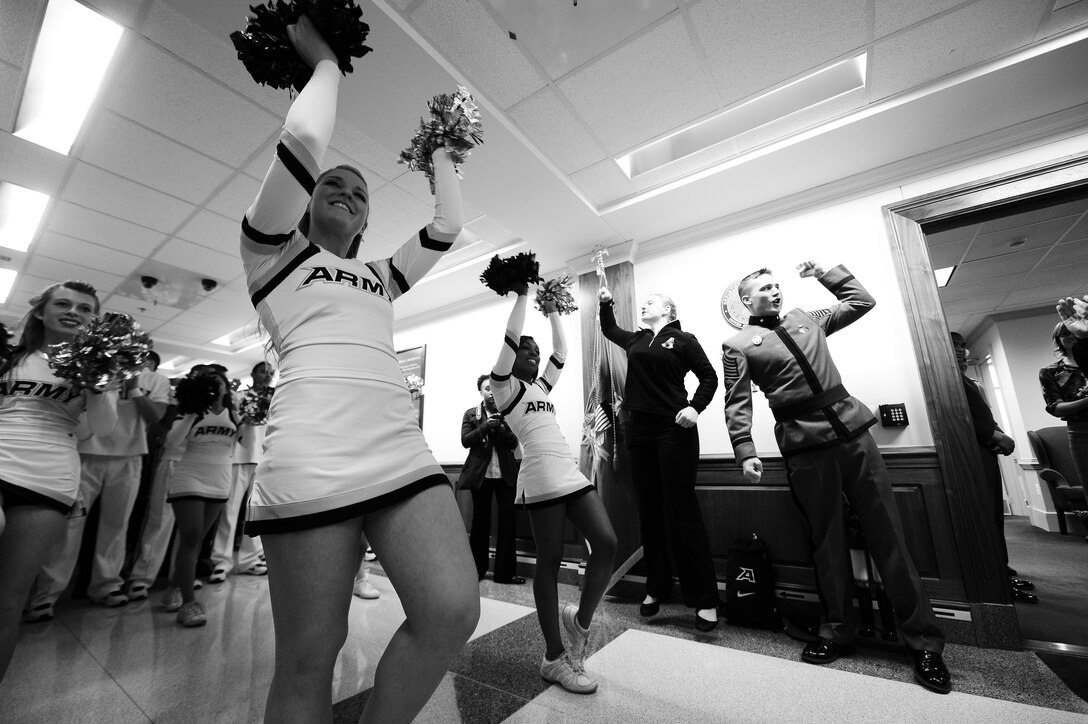 Army cheerleaders perform during a pep rally for cadets from the U.S