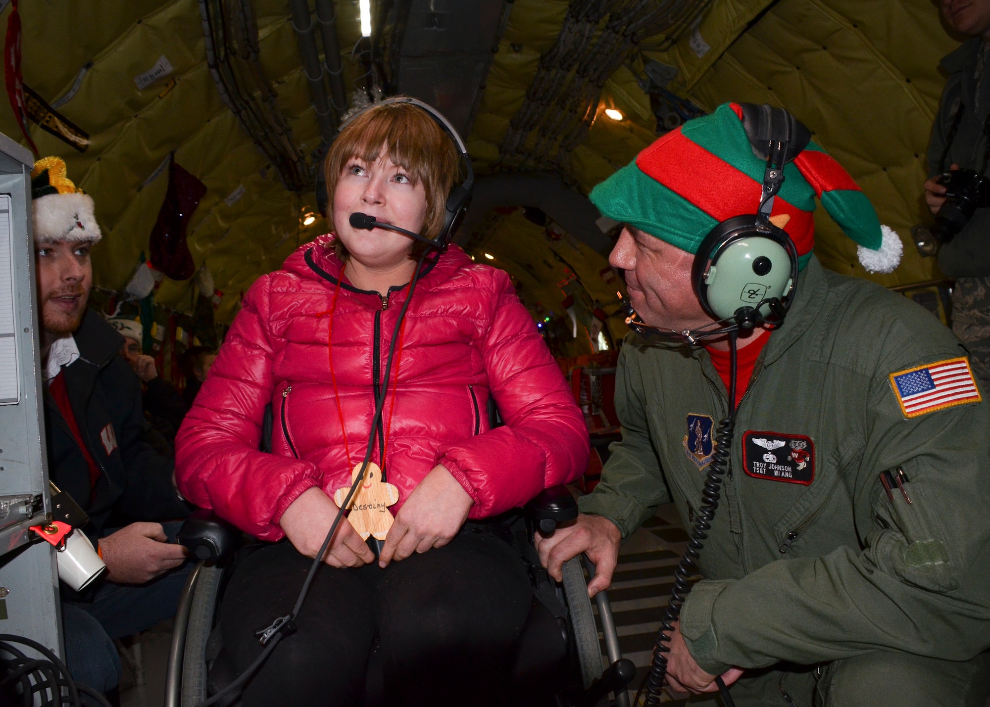 Destiny Cottrell, 18, tells Santa what she wants for Christmas as she flies to the North Pole.  The annual Flight to the North Pole is hosted by the 128th Air Refueling Wing, Wisconsin Air National Guard, Milwaukee Dec. 13, 2014 here.  (U.S. Air National Guard photo by Master Sgt. Thomas J. Sobczyk/Released)