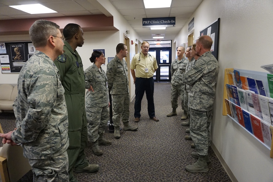 Lt. Gen. Stephen Wilson,  Air Force Global Strike Command commander, meets with Airmen assigned to the Personal Reliability Program Clinic at the Medical Treatment Facility on F.E. Warren Air Force Base, Dec. 10, 2014. Airmen on PRP now have less follow-up appointments after off-base treatment thanks to the Force Improvement Program, which results in less time spent away from the mission. (U.S. Air Force photo/Lan Kim)