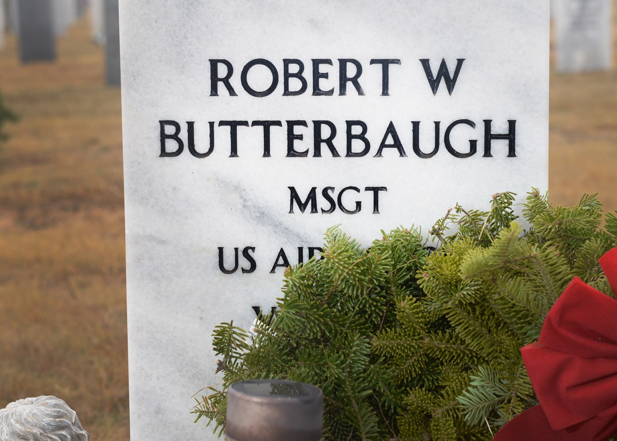 ALTUS AIR FORCE BASE, Okla. – A wreath is laid at the headstone of retired U.S. Air Force Master Sgt. Robert Butterbaugh at the Altus Cemetery, Dec. 13, 2014. The wreath was laid as a part of Wreaths Across America Day, where volunteers at 900 different locations around the world placed wreaths to honor fallen veterans. (U.S. Air Force photo by Senior Airman Levin Boland/Released)