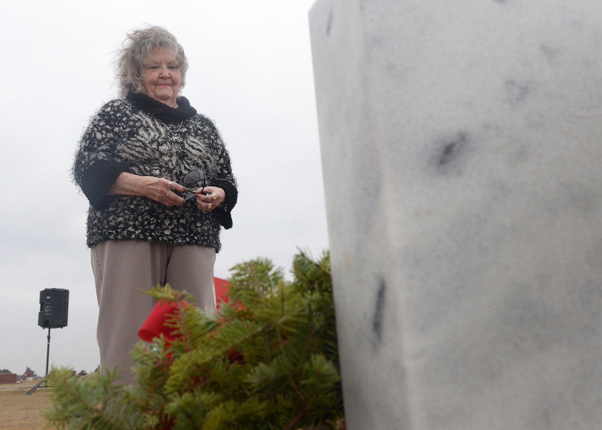 ALTUS AIR FORCE BASE, Okla. – Jackie Butterbaugh visits her late husband’s headstone at the Altus Cemetery, Dec. 13, 2014. Jackie’s husband, retired U.S. Air Force Master Sgt. Robert Butterbaugh, was one of 1,300 headstones at the Altus Cemetery that received a wreath. (U.S. Air Force photo by Senior Airman Levin Boland/Released)