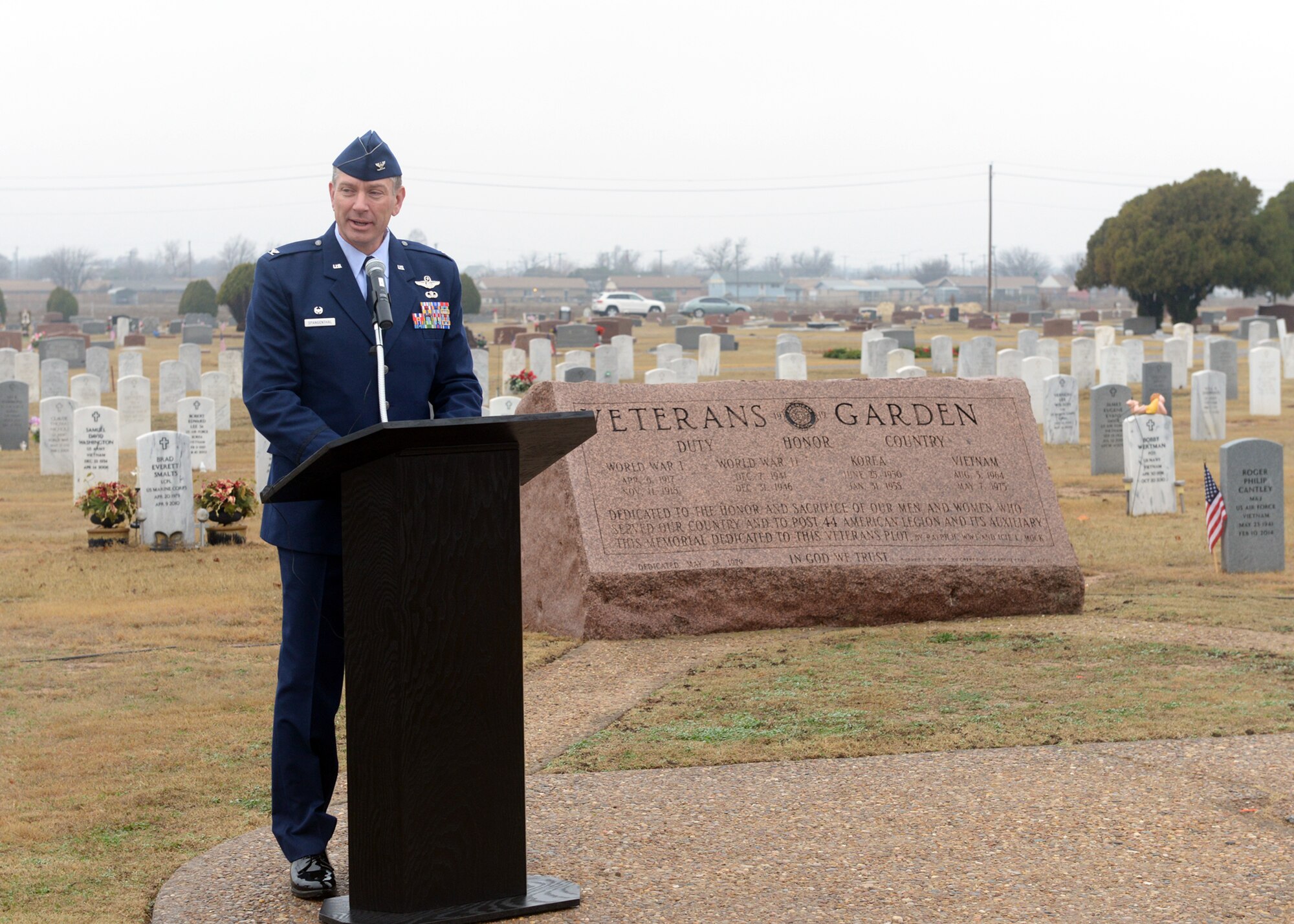 ALTUS AIR FORCE BASE, Okla. – U.S. Air Force Col. Bill Spangenthal, 97th Air Mobility Wing commander, speaks during a wreath laying ceremony at the Altus Cemetery, Dec. 13, 2014. The ceremony was held as a part of Wreaths Across Day, where volunteers at 900 different locations around the world placed wreaths to honor fallen veterans. (U.S. Air Force photo by Senior Airman Levin Boland/Released)