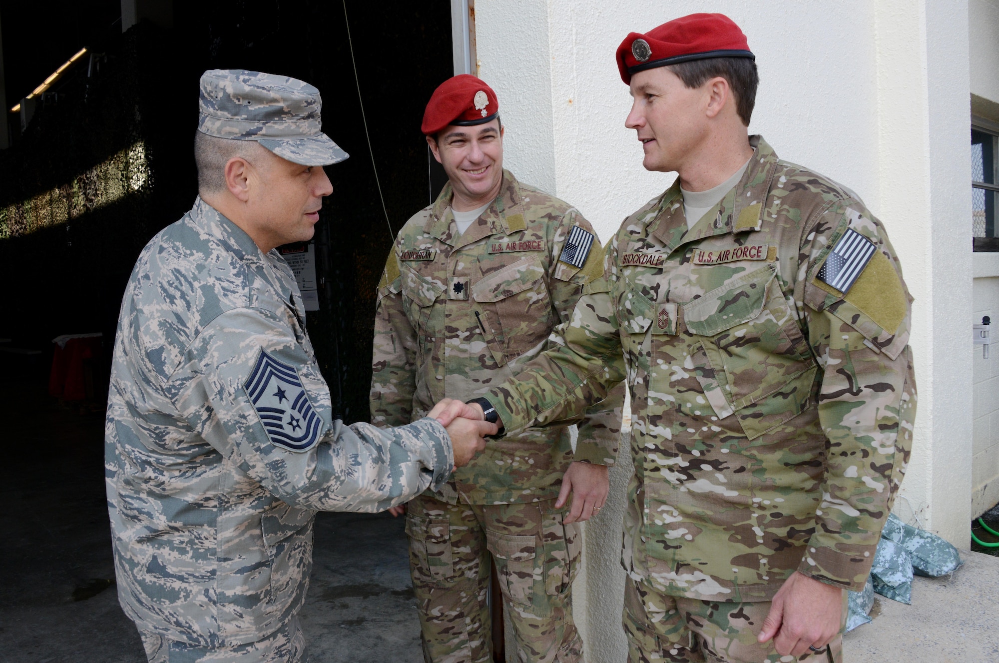 Chief Master Sgt. Matthew Caruso, command chief master sergeant for Air Force Special Operations Command, shakes hands with Chief Master Sgt. Michael Stockdale, 320th Special Tactics Squadron, chief enlisted manager, after completing a tour of the squadron Dec. 5, 2014 at Kadena Air Base, Japan.  Caruso and Lt. Gen. Bradley Heithold, AFSOC commander, toured 353rd Special Operations Group facilities and met with Airmen during their visit.  AFSOC leadership visited the men and women of the 353rd SOG to get a closer look at the special operations mission in the Pacific. (U.S. Air Force photo by Tech. Sgt. Kristine Dreyer)