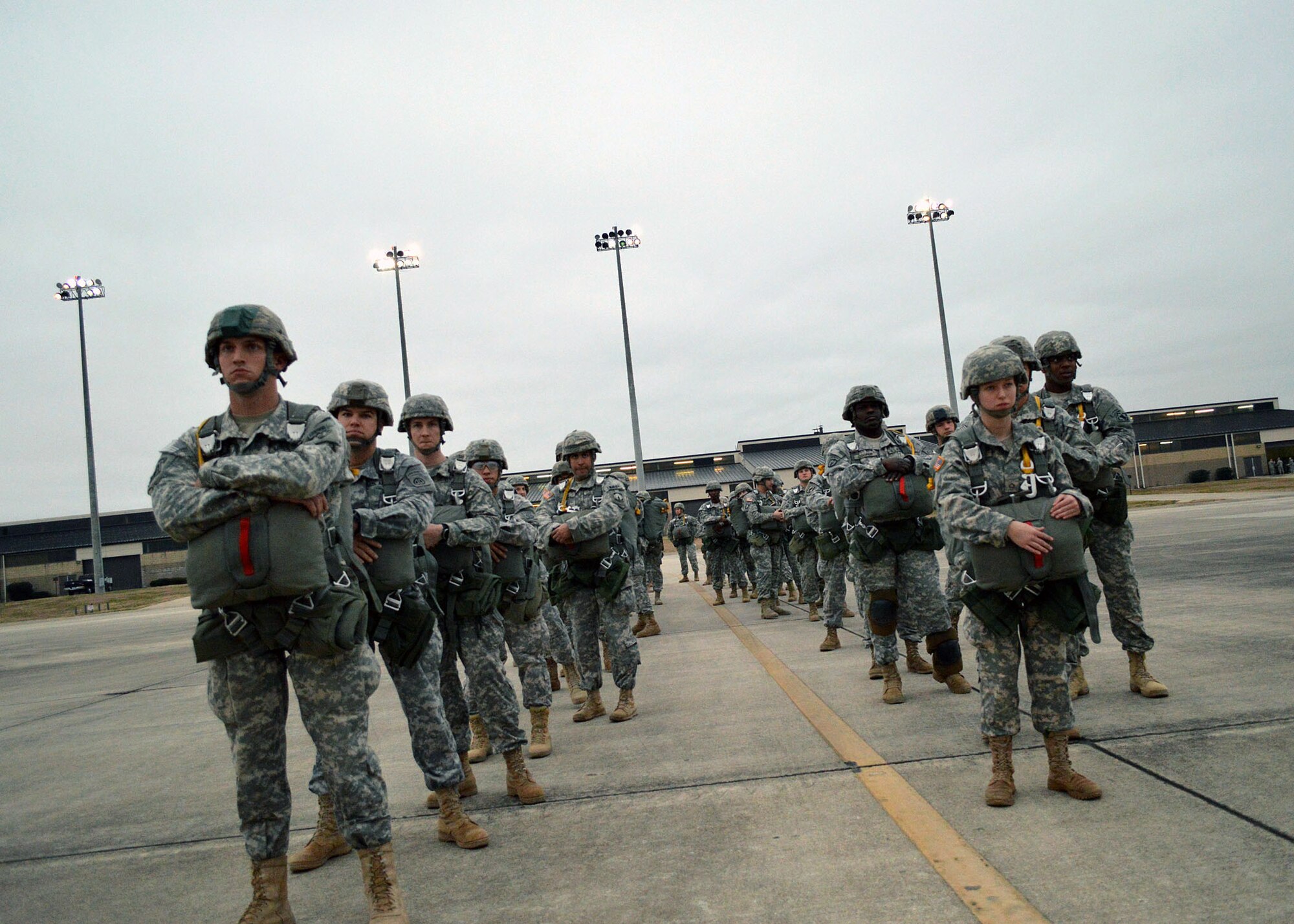 U.S. Army paratroopers wait to board an U.S. Air Force C-130 Hercules aircraft during the 17th Annual Randy Oler Memorial Operation Toy Drop on Dec. 6 at Green Ramp, Pope Army Airfield, Fort Bragg, North Carolina. Operation Toy Drop is the world’s largest combined airborne operation where Soldiers donate a toy to receive a lottery ticket number that are then randomly drawn for an opportunity to train and jump with foreign jumpmasters over Sicily Drop Zone. Foreign jumpmasters from Poland, Italy, Latvia, Germany,Indonesia and the Netherlands participated in this year’s event. Last year, Operation Toy Drop collected more than 12,000 toys that were donated to local charities and organizations across North Carolina. (U.S. Air Force photo/Marvin Krause)
