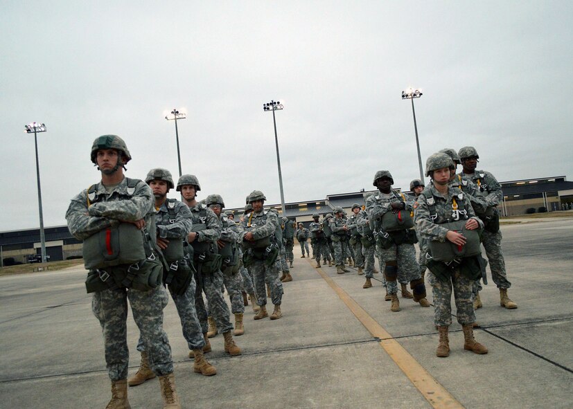 U.S. Army paratroopers wait to board an U.S. Air Force C-130 Hercules aircraft during the 17th Annual Randy Oler Memorial Operation Toy Drop on Dec. 6 at Green Ramp, Pope Army Airfield, Fort Bragg, North Carolina. Operation Toy Drop is the world’s largest combined airborne operation where Soldiers donate a toy to receive a lottery ticket number that are then randomly drawn for an opportunity to train and jump with foreign jumpmasters over Sicily Drop Zone. Foreign jumpmasters from Poland, Italy, Latvia, Germany,Indonesia and the Netherlands participated in this year’s event. Last year, Operation Toy Drop collected more than 12,000 toys that were donated to local charities and organizations across North Carolina. (U.S. Air Force photo/Marvin Krause)