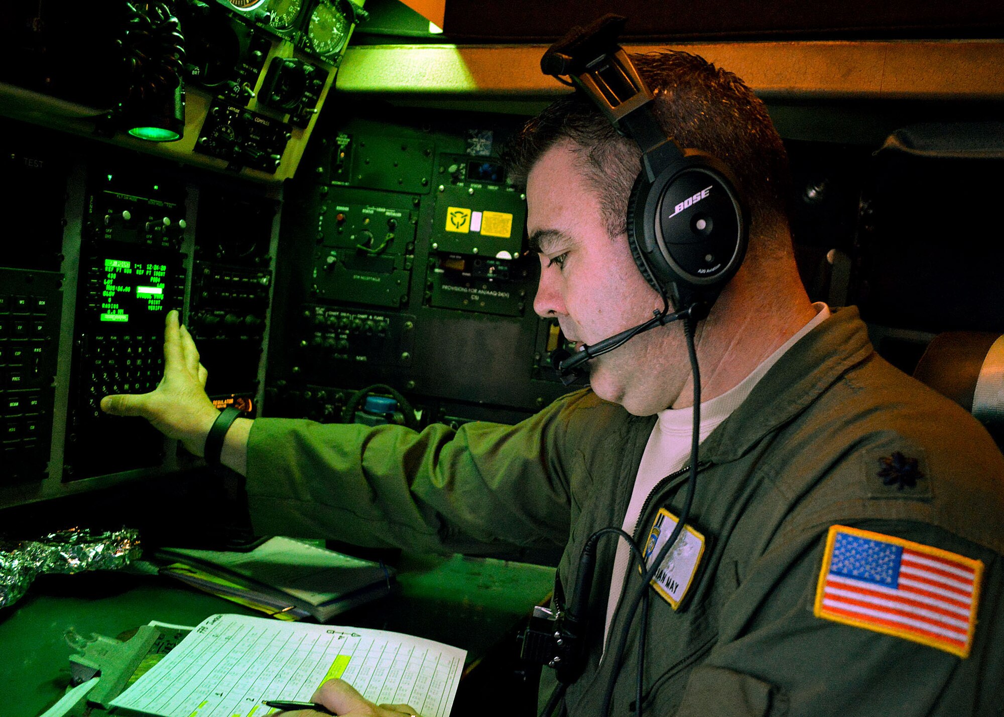 U.S. Air Force Reserve Lt. Col. Brian May, a C-130H Hercules navigator and 95th Airlift Squadron director of operations, conducts mission planning aboard an Air Force Reserve C-130H Hercules aircraft prior to airborne operations during the 17th Annual Randy Oler Memorial Operation Toy Drop on Dec. 6 at Green Ramp, Pope Army Airfield, Fort Bragg, North Carolina. Operation Toy Drop is the world’s largest combined airborne operation where Soldiers donate a toy to receive a lottery ticket number that are then randomly drawn for an opportunity to train and jump with foreign jumpmasters over Sicily Drop Zone. Foreign jumpmasters from Poland, Italy, Latvia, Germany, Indonesia and the Netherlands participated in this year’s event. Last year, Operation Toy Drop collected more than 12,000 toys that were donated to local charities and organizations across North Carolina. (U.S. Air Force photo/Marvin Krause)