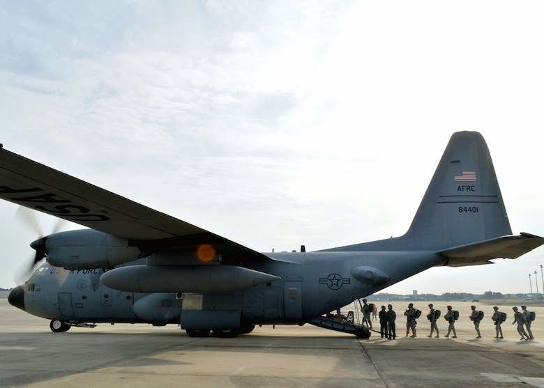 U.S. Army paratroopers and foreign jumpmasters board an Air Force Reserve Command C-130H Hercules aircraft from the 440th Airlift Wing, during 17th Annual Randy Oler Memorial Operation Toy Drop on Dec. 5 at Green Ramp, Pope Army Airfield, Fort Bragg, North Carolina. Operation Toy Drop is the world’s largest combined airborne operation where Soldiers donate a toy to receive a lottery ticket number that are then randomly drawn for an opportunity to train and jump with foreign jumpmasters over Sicily Drop Zone. Foreign jumpmasters from Poland, Italy, Latvia, Germany, Indonesia and the Netherlands participated in this year’s event. Last year, Operation Toy Drop collected more than 12,000 toys that were donated to local charities and organizations across North Carolina. (U.S. Air Force photo/Marvin Krause)