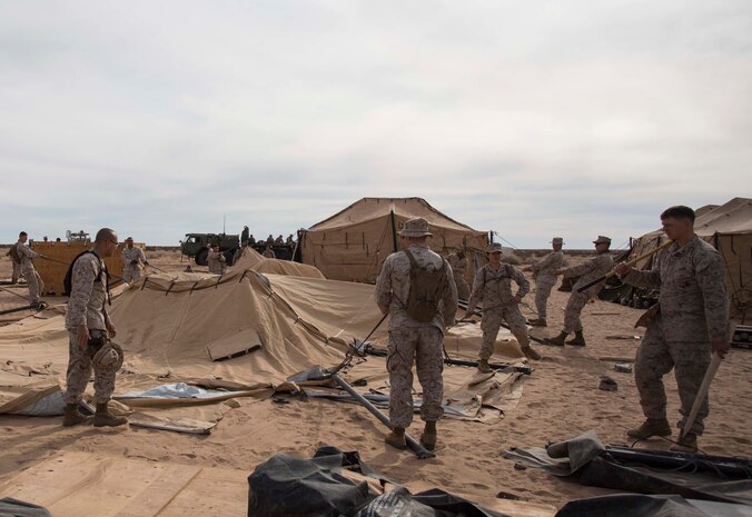 Marines with Marine Wing Support Squadron 371 build sleeping posts during the security force exercise in support of pre-deployment training Dec. 7-10, 2014, at the Auxiliary Landing Field II on Marine Corps Air Station Yuma, Ariz. (U.S. Marine Corps photo by Cpl. Reba James/Released)