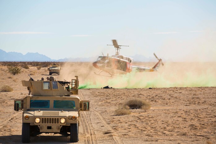 A Marine search and rescue team with Marine Corps Air Station Yuma, Ariz., arrives at the landing zone for a casualty evacuation in support of Marine Wing Support Squadron 371 during the security force exercise in support of pre-deployment training Dec. 7-10, 2014, at the Auxiliary Landing Field II on station. The Search and Rescue team provided support during a practical application of casualty evacuation. (U.S. Marine Corps photo by Cpl. Reba James/ Released)