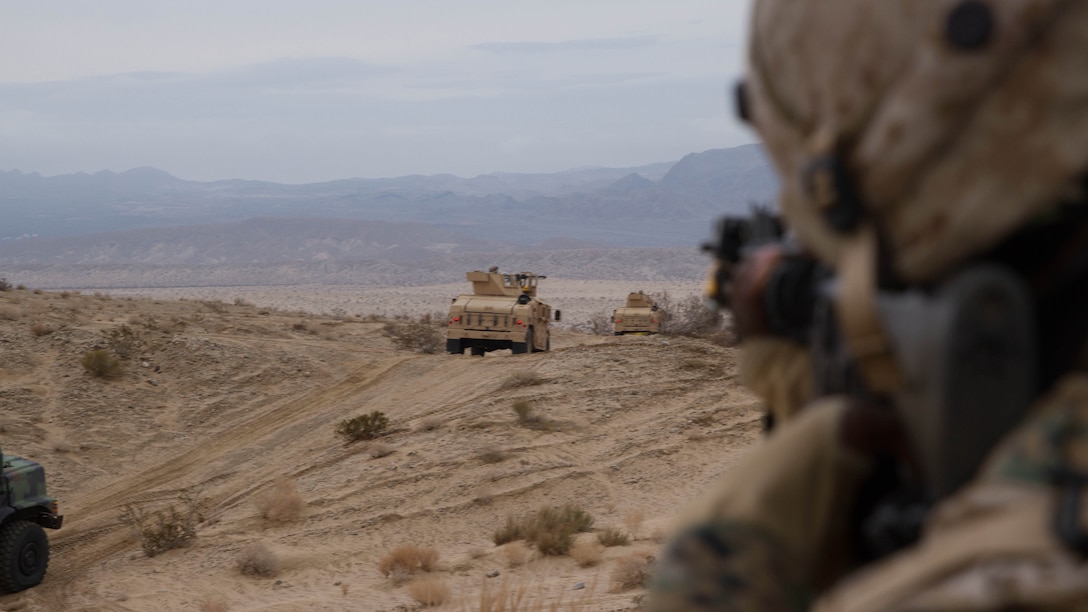 A Marine with Truck Company, Combat Logistics Battalion 5, acts as an enemy soldier attacking convoy in support of Exercise Steel Knight 2015 at Marine Corps Air Ground Combat Center Twentynine Palms, Calif., Dec. 4, 2014. The exercise gave the Marines the opportunity to refine and rehearse essential combat skills needed in a combat environment. Steel Knight is an annual exercise that includes elements from the entire I Marine Expeditionary Force. The exercise focuses on conventional operations and provides realistic training that prepares Marine for overseas operations. 
