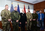 Personnel from the Danish Division meet with Pennsylvania Adjutant General Maj. Gen. Wesley Craig during a visit to Fort Indiantown Gap, Pennsylvania., Dec. 11, 2014. The Danish Division is on a seven-day collaborative planning visit to Pennsylvania to prepare for Saber Strike 2015 with the 28th Infantry Division, Pennsylvania Army National Guard. 