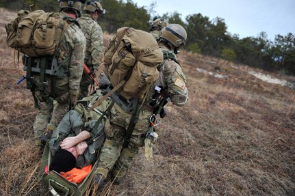 Air Force pararescue jumpers with the 102nd Rescue Squadron simulate recovering a downed F-16 pilot during training at F.S. Gabreski Air National Guard Base in Westhampton, New York, March 25, 2013. 