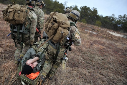 Air Force pararescue jumpers with the 102nd Rescue Squadron simulate recovering a downed F-16 pilot during training at F.S. Gabreski Air National Guard Base in Westhampton, New York, March 25, 2013. 