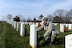 Lt. Col. David Burnett lays a wreath on a tombstone during the 23rd Annual National Wreaths Across America Day Dec. 13, 2014, at Arlington National Cemetery, Virginia. Burnett, assigned to the Joint Staff, J1, Plans and Readiness Personnel Readiness Division at the Pentagon, was one of the nearly 50,000 volunteers at Arlington. (U.S. Air Force photo/Staff Sgt. Christopher Gross)
