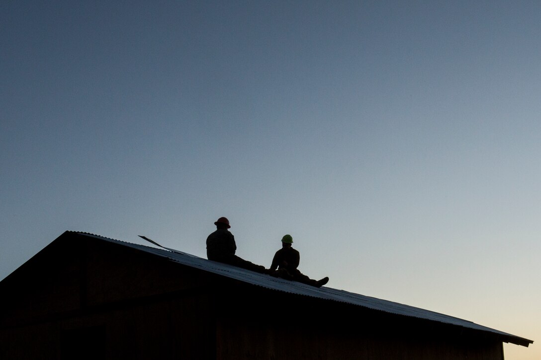U.S. Marines with Combat Logistics Battalion 15, 15th Marine Expeditionary Unit, install roofing on a Southwest Asia hut during realistic urban training aboard Fort Hunter Liggett, Calif., Dec. 14, 2014. RUT prepares the 15th MEU's Marines for their upcoming deployment, enhancing their combat skills in environments similar to those they may find in future missions. (U.S. Marine Corps photo by Sgt. Jamean Berry/Released)