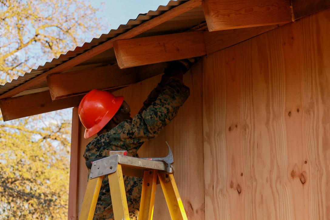 U.S. Marine Cpl. Shaquille Ross installs components of a Southwest Asia hut during realistic urban training aboard Fort Hunter Liggett, Calif., Dec. 14, 2014. Ross is a combat engineer with Combat Logistics Battalion 15, 15th Marine Expeditionary Unit. RUT prepares the 15th Marine Expeditionary Unit's Marines for their upcoming deployment, enhancing their combat skills in environments similar to those they may find in future missions. (U.S. Marine Corps photo by Sgt. Jamean Berry/Released)