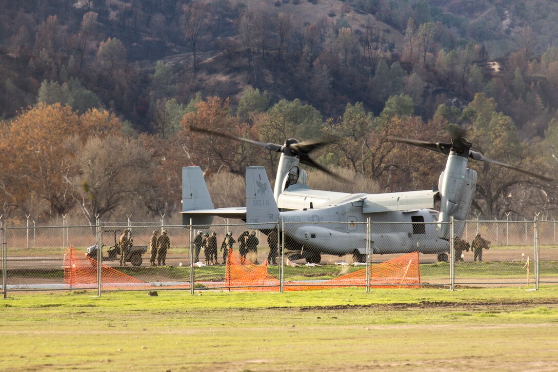 U.S. Marines with Battalion Landing Team 3rd Battalion, 1st Marine Regiment, 15th Marine Expeditionary Unit, disembark an MV-22 Osprey from Marine Medium Tiltrotor Squadron 161 (Reinforced), 15th MEU, during realistic urban training aboard Fort Hunter Liggett, Calif., Dec. 13, 2014.  RUT prepares the 15th MEU's Marines for their upcoming deployment, enhancing their combat skills in environments similar to those they may find in future missions. (U.S. Marine Corps Photo by Sgt. Jamean Berry/Released)