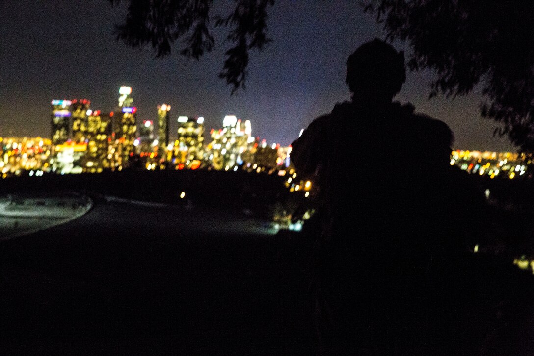 A U.S. Marine with the 15th Marine Expeditionary Unit’s Maritime Raid Force holds security during realistic urban training in Los Angeles Dec. 13, 2014. RUT prepares the 15th MEU’s Marines for their upcoming deployment, enhancing their combat skills in environments similar to those they may find in future missions. (U.S. Marine Corps photo Cpl. Anna Albrecht/Released)