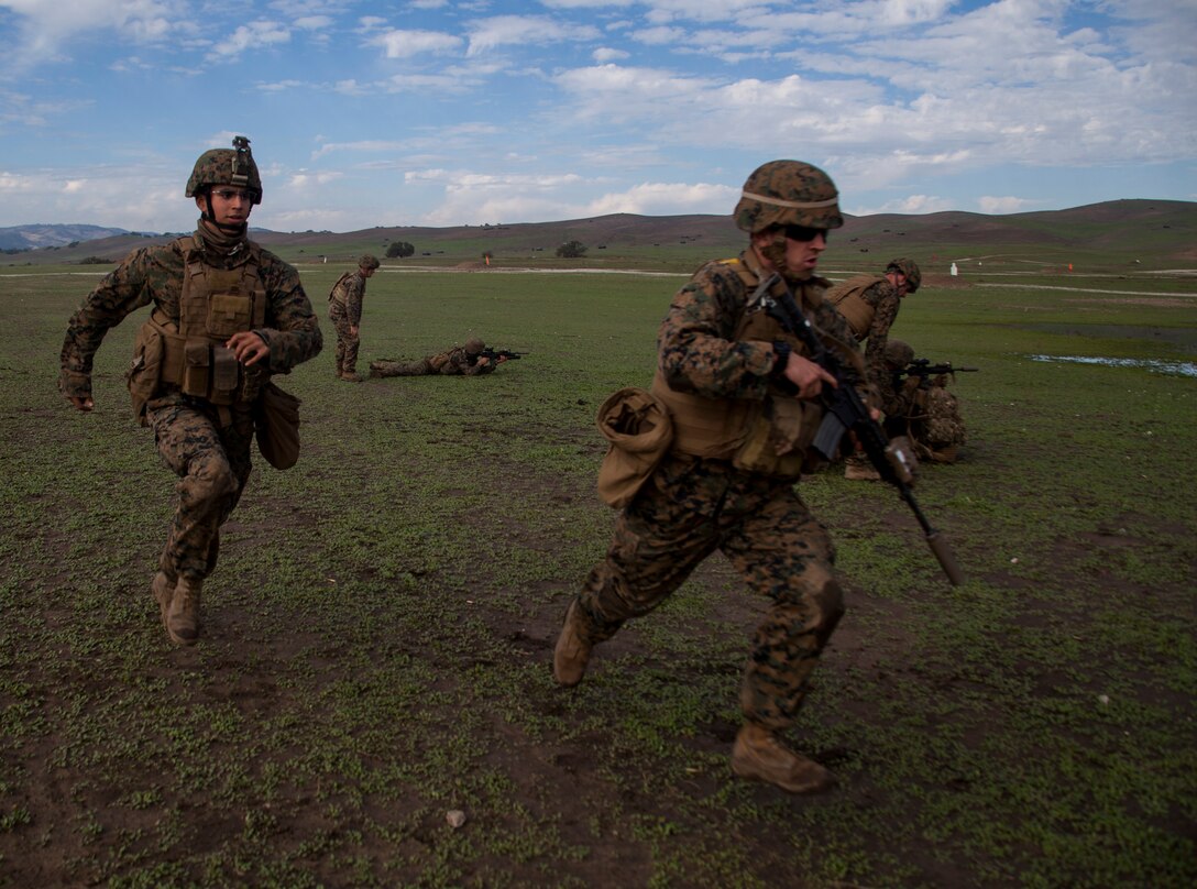 U.S. Marines with Weapons Company, Battalion Landing Team 3rd Battalion, 1st Marine Regiment, 15th Marine Expeditionary Unit, practice buddy-rushing techniques during realistic urban training aboard Camp Roberts, Calif., Dec. 14, 2014. RUT prepares the 15th MEU’s Marines for their upcoming deployment, enhancing their combat skills in environments similar to those they may find in future missions. (U.S. Marine Corps photo by Cpl. Elize McKelvey/Released)