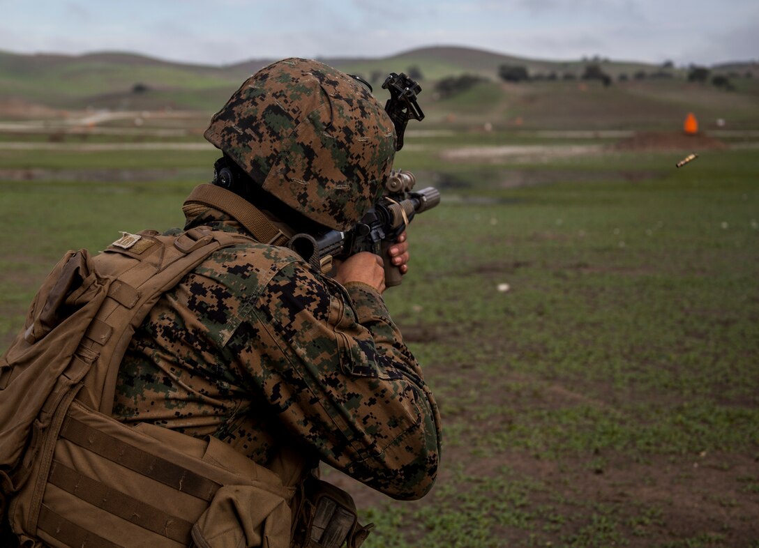 U.S. Marine Cpl. Cheexeng Lee fires at targets during realistic urban training aboard Camp Roberts,Calif., Dec. 14, 2014. Lee is a basic rifleman with Weapons Company, Battalion Landing Team 3rd Battalion, 1st Marine Regiment, 15th Marine Expeditionary Unit. RUT prepares the 15th MEU’s Marines for their upcoming deployment, enhancing their combat skills in environments similar to those they may find in future missions. (U.S. Marine Corps photo by Cpl. Elize McKelvey/Released)