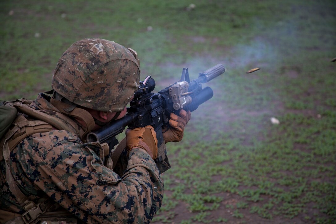 U.S. Marine Cpl. Mathew Backer fires at targets during realistic urban training aboard Camp Roberts, Calif., Dec. 14, 2014. Backer is a rifleman with Weapons Company, Battalion Landing Team 3rd Battalion, 1st Marine Regiment, 15th Marine Expeditionary Unit. RUT prepares the 15th MEU’s Marines for their upcoming deployment, enhancing their combat skills in environments similar to those they may find in future missions. (U.S. Marine Corps photo by Cpl. Elize McKelvey/Released)