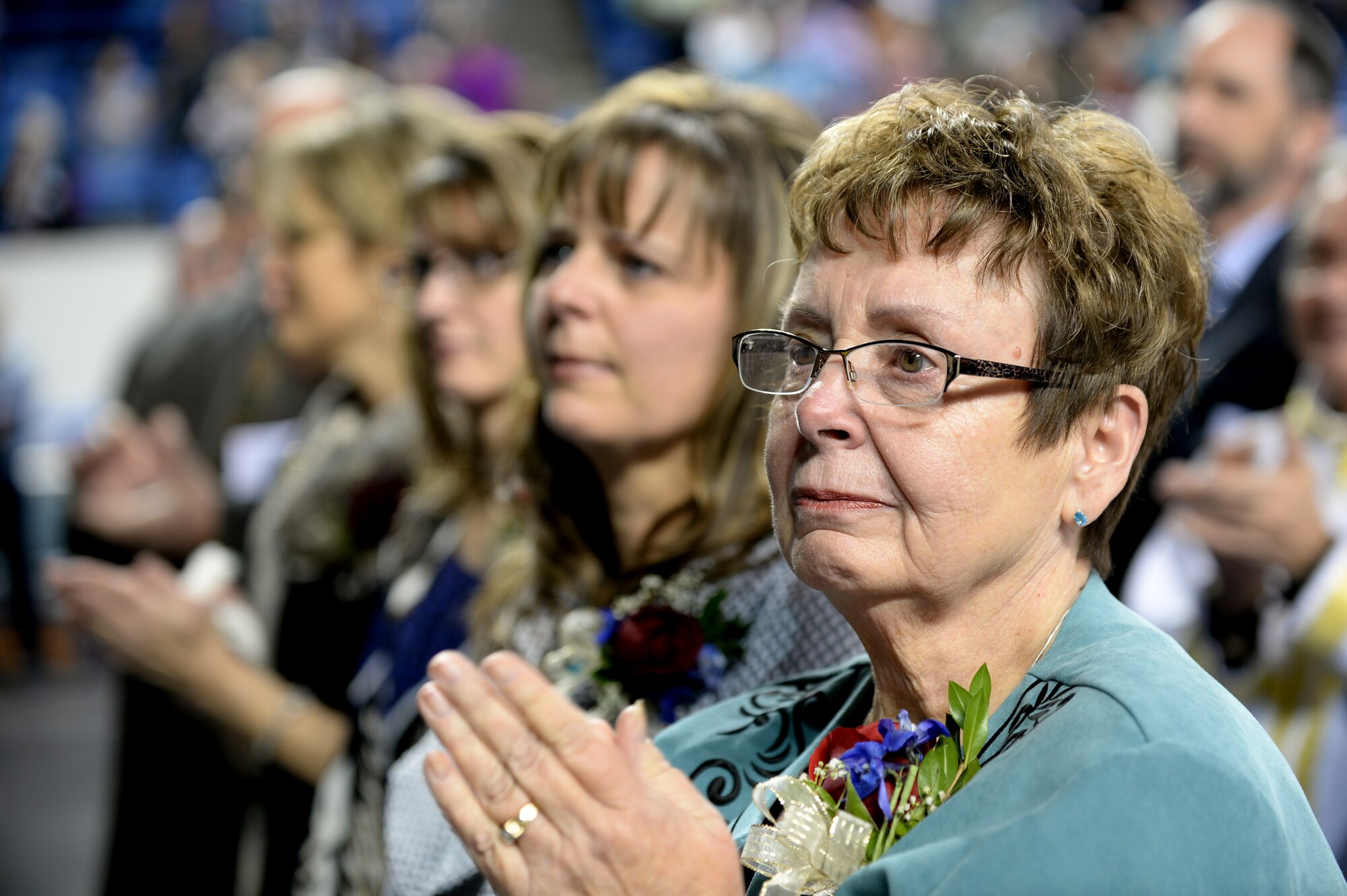 Linda Zielinski, mother of Chaplain (Maj.) Chad Zielinski, the 354th Fighter Wing deputy wing chaplain, weeps after watching her son become ordained the bishop of the Fairbanks Catholic diocese Dec. 15, 2014 at the Carlson Center, Fairbanks, Alaska. Zielinski is the oldest of five children born to Linda and his father Donald. (U.S. Air Force photo by Staff Sgt. Shawn Nickel/Released)