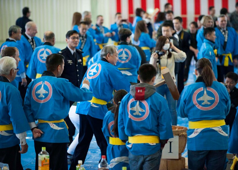 Members of the 35th Fighter Wing and Japan Air-Self Defense Force participate in the annual Mochi Pounding Ceremony at a JASDF facility at Misawa Air Base, Japan, Dec. 15. 2014. According to JASDF Maj. Gen. Hirohide Inoue, 3rd Air Wing commander, the making of Mochi highlights the relationship of the 35th Fighter Wing, JASDF and Misawa City by working in a partnership as one community. (U.S. Air Force photo by Staff Sgt. Tong Duong/Released)