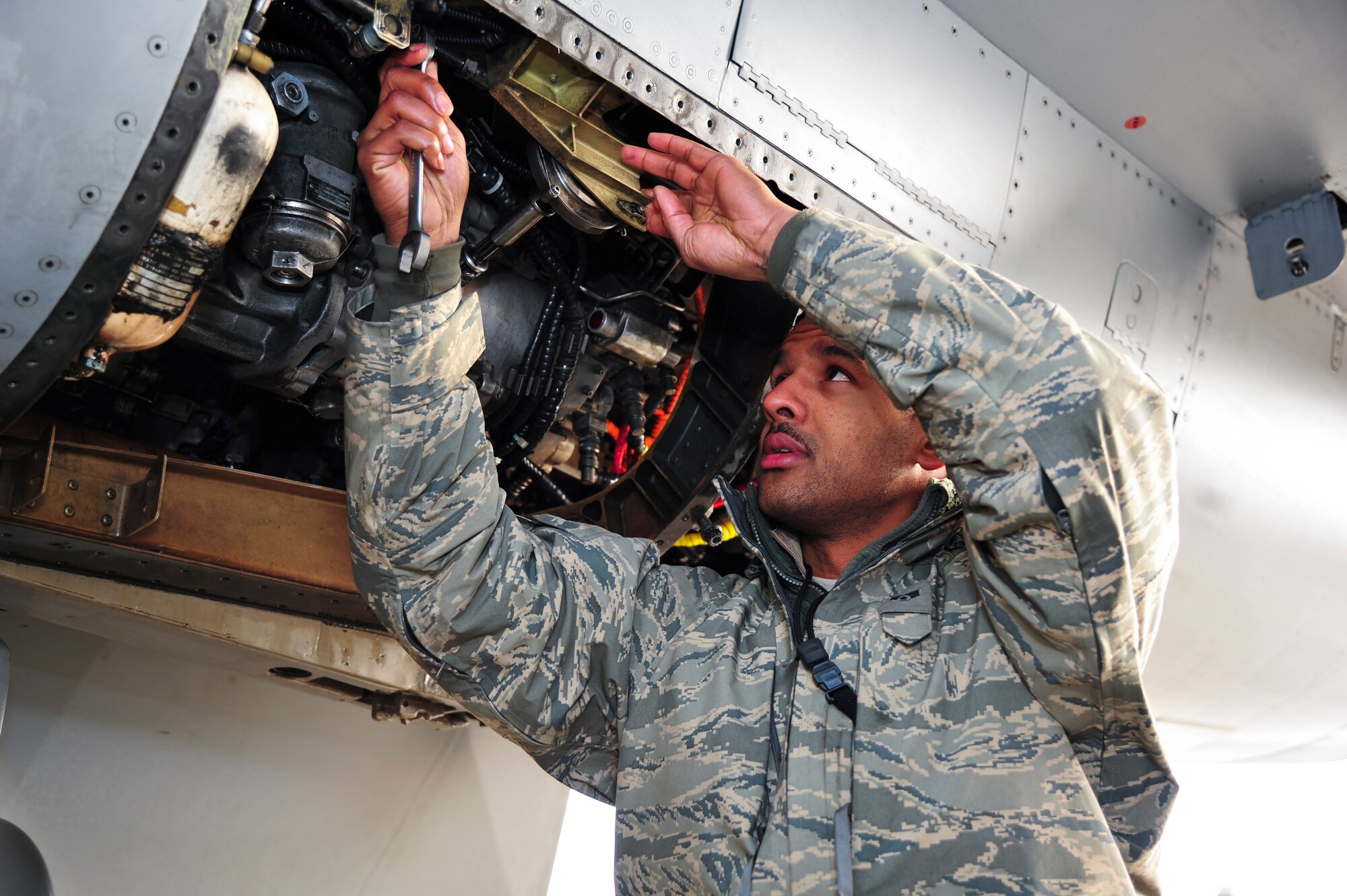 Senior Airman Keith Rice, 36th Aircraft Maintenance Unit propulsion systems journeyman, tightens a bolt on an F-16 Fighting Falcon Dec. 12, 2014, during a post flight inspection at Osan Air Base, Republic of Korea. Rice is this week's Airman Spotlight winner. (U.S. Air Force photo by Senior Airman David Owsianka)