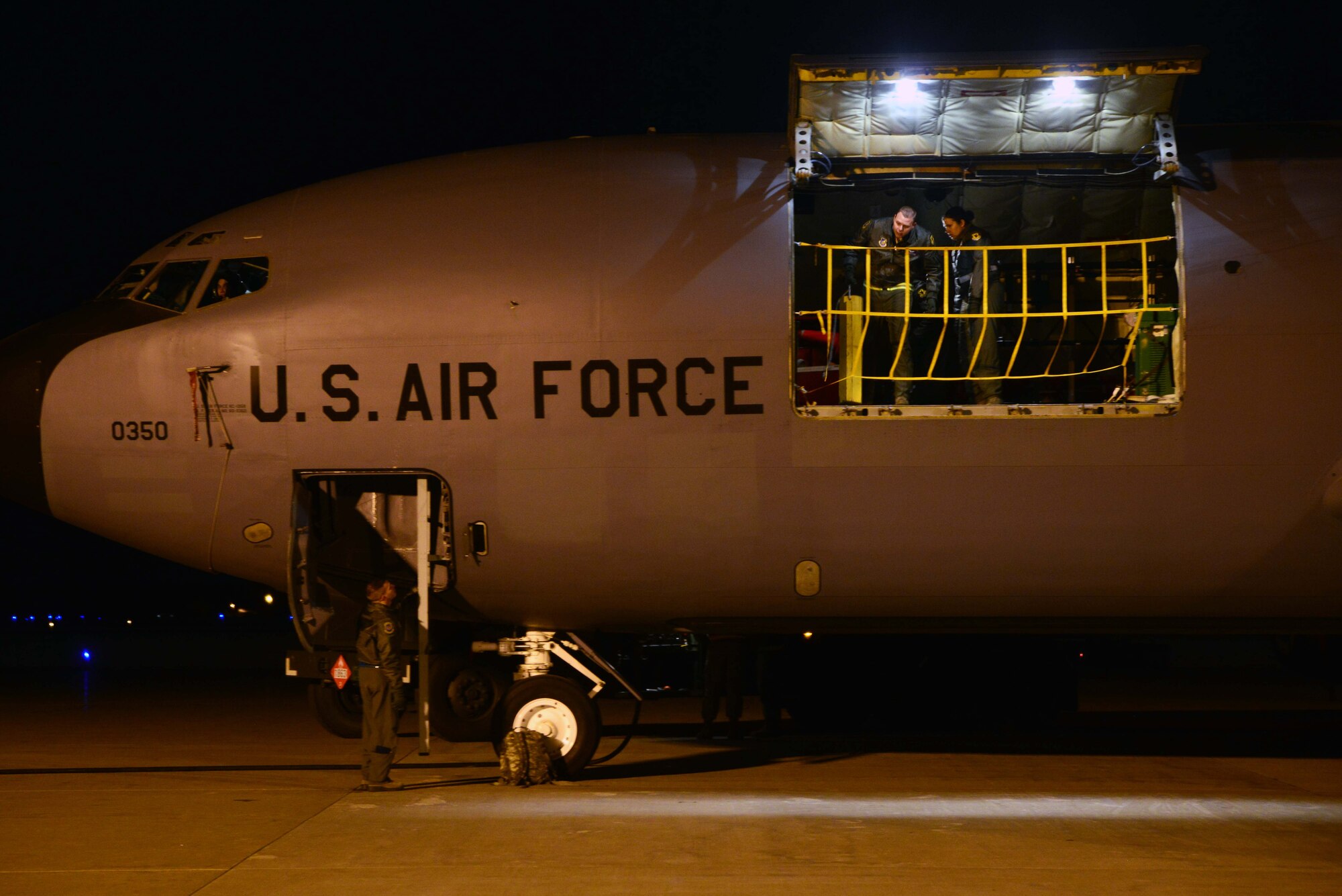 Airmen from Kadena Air Base, Japan, prepare for an aeromedical evacuation exercise on a KC-135 Stratotanker Dec. 5, 2014, at Misawa Air Base, Japan. The operation was executed in support of Beverly Sunrise 15-1, a large-scale exercise that incorporated five Pacific Air Forces bases and lasted about a week. (U.S. Air Force photo by Staff Sgt. Derek VanHorn/Released)
