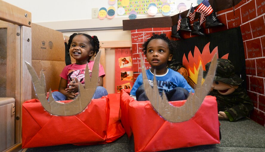Alanna Ware, daughter of U.S. Air Force Tech. Sgt. Davisha Ware, 23d Mission Support Group, and Aiden Luckett, son of Tech. Sgt. Michelle Luckett, 23d Wing Equal Opportunity, sit in sleighs during Winter Wonderland Dec. 12, 2014, at Moody Air Force Base, Ga. Winter Wonderland gave parents the opportunity to play with their children at the Child Development Center II. (U.S. Air Force photo by Senior Airman Sandra Marrero/Released)
