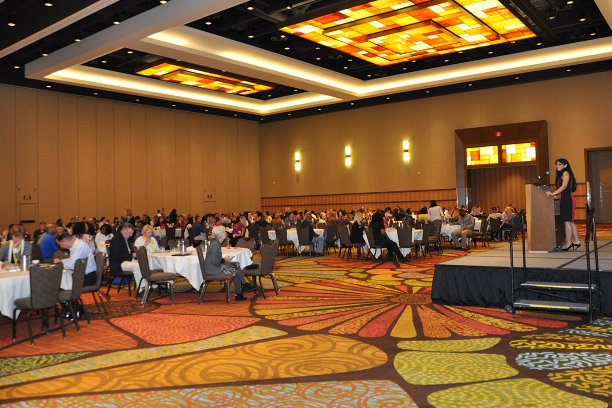 Maj. Roxy Hambleton, 482nd Force Support Squadron chief of military personnel services at Homestead Air Reserve Base, Fla.,  and Yellow Ribbon representative, serves as Master of Ceremonies for the Nov. 21-23 Yellow Ribbon Conference in Orlando, Fla. The conference was attended by over 800 Air Force Reserve members, their families and their guests. (U.S. Air Force photo/Master Sgt. James Branch)