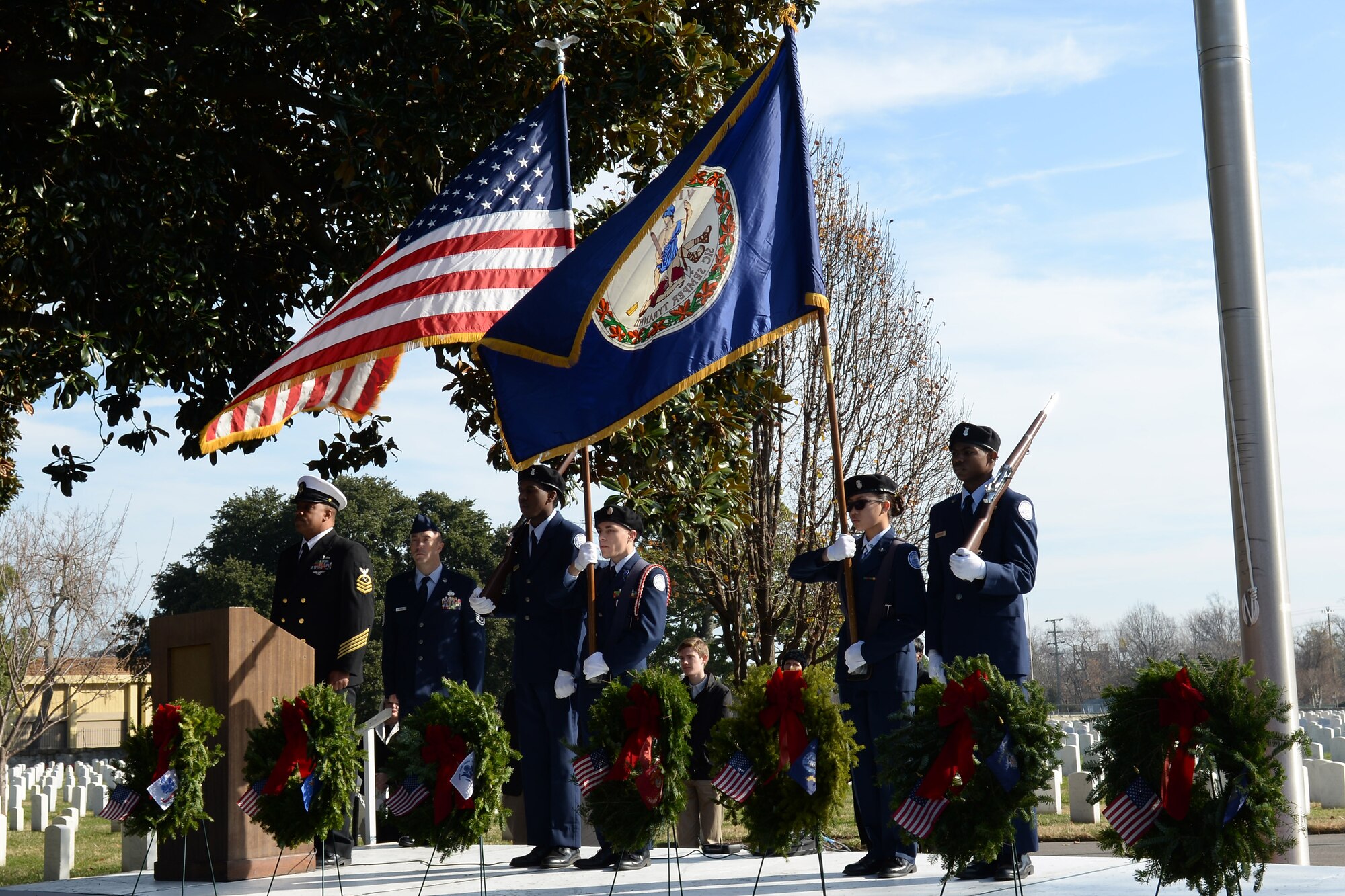 U.S. Air Force Junior ROTC cadets from Hampton High School present the colors during the Wreaths Across America Day wreath-laying ceremony at the Hampton National Cemetery in Hampton, Va., Dec. 13, 2014. Junior ROTC units from Hampton, Surry and Bethel high schools participated in the event. (U.S. Air Force photo by Staff Sgt. Teresa J. Cleveland/Released)