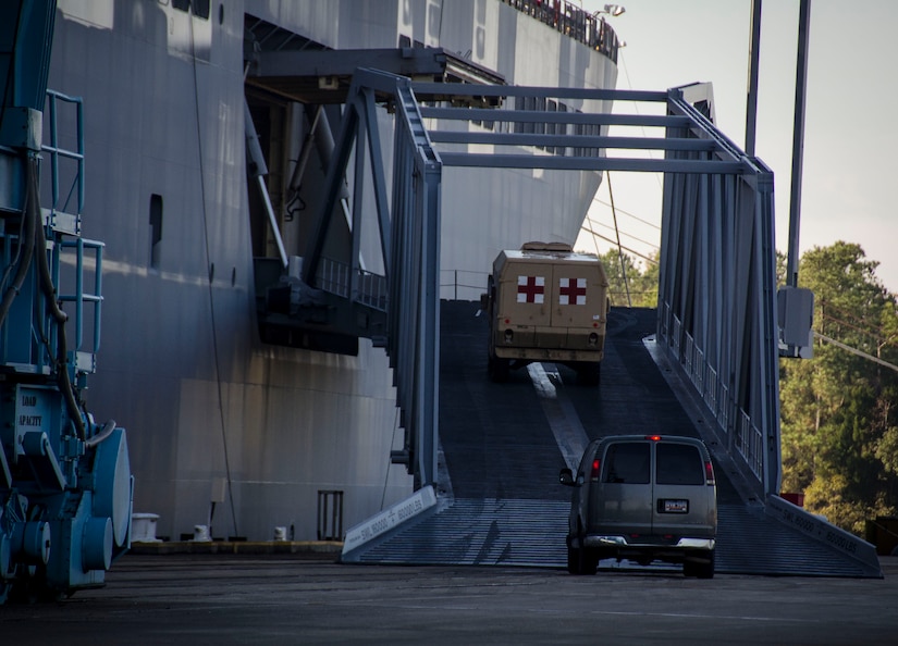 A medical vehicle is driven onto the USNS Watkins (T-AKR 315), Dec. 15, 2014, at Joint Base Charleston, S.C. Once loaded with more than 1,200 pieces of military equipment, the 950-foot long ship will embark to a prepositioned location overseas. (U.S. Air Force photo / Senior Airman Tom Brading)