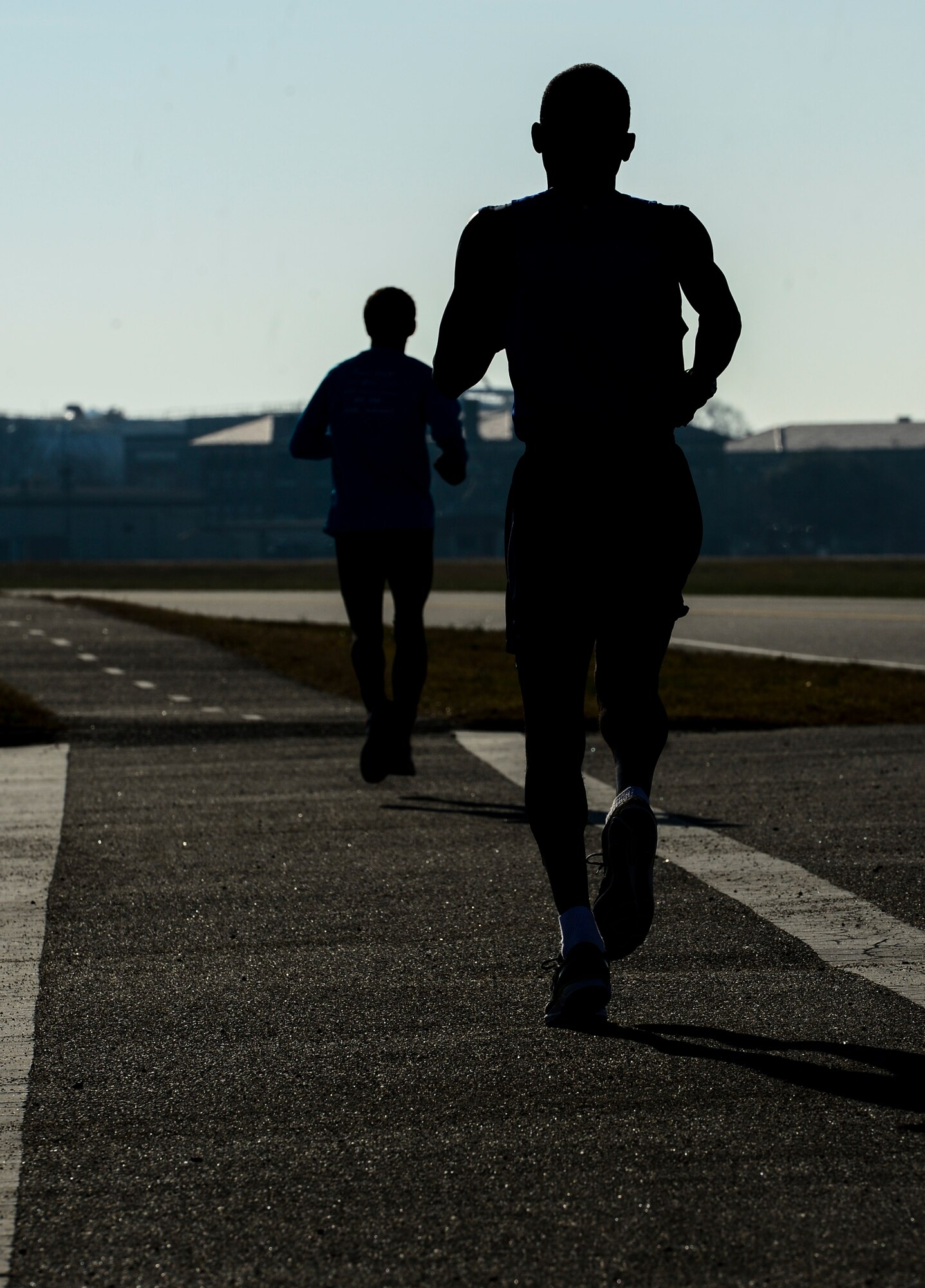 Runners participate in the 5th annual Race Round’ the Base at Langley Air Force Base, Va., Dec. 13, 2014. The race was open to the local community after coordinating with the 633rd Force Support Squadron. (U.S. Air Force photo by Senior Airman Kayla Newman/Released)  