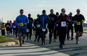 Participants run during the 5th annual Race Round’ the Base at Langley Air Force Base, Va., Dec. 13, 2014. Runners could sign up to run a 10-mile loop or 5k course around Langley Air Force Base. (U.S. Air Force photo by Senior Airman Kayla Newman/Released) 